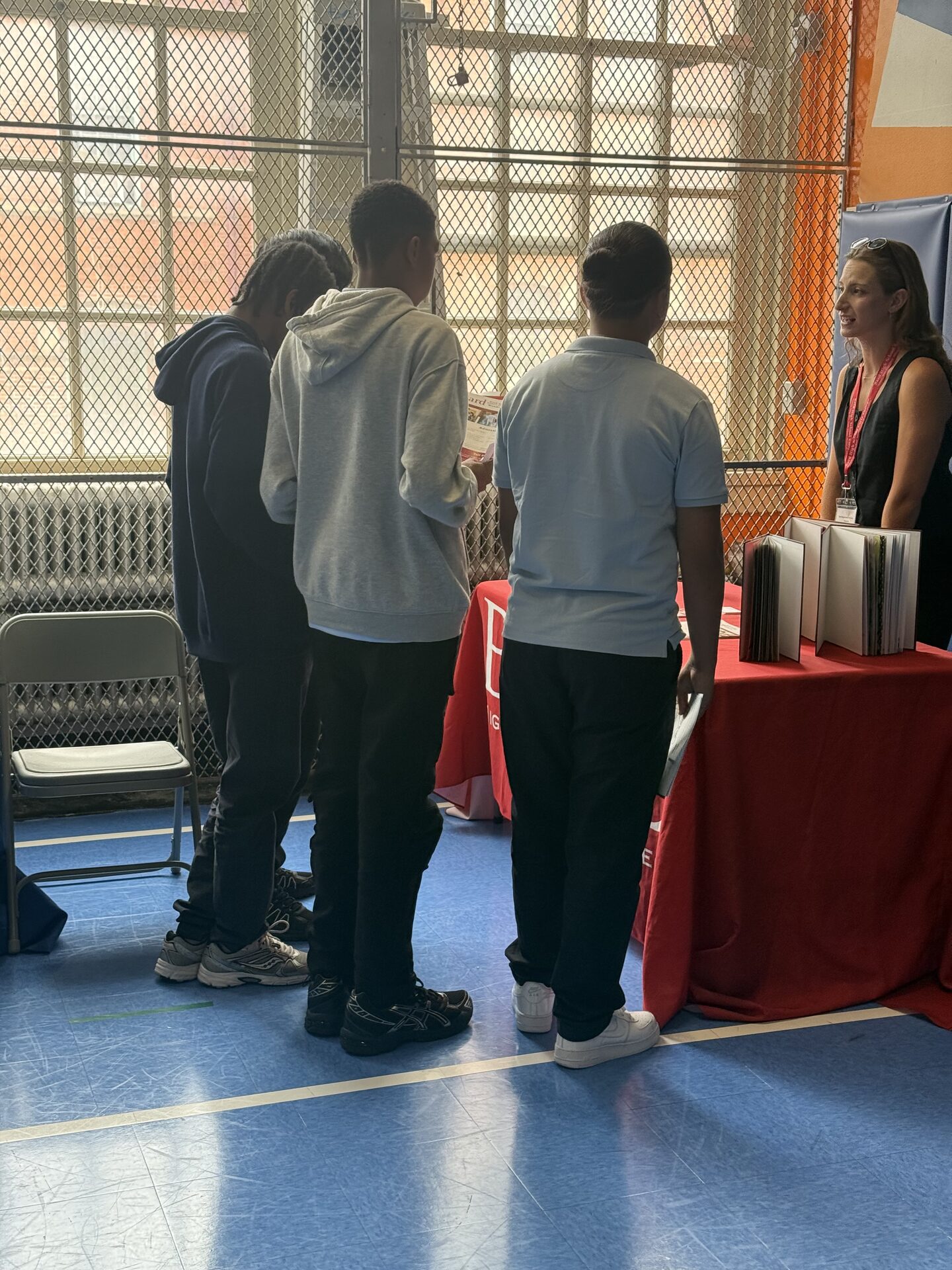 The Lexington Academy — Students speaking with a high school representative at the High School Fair